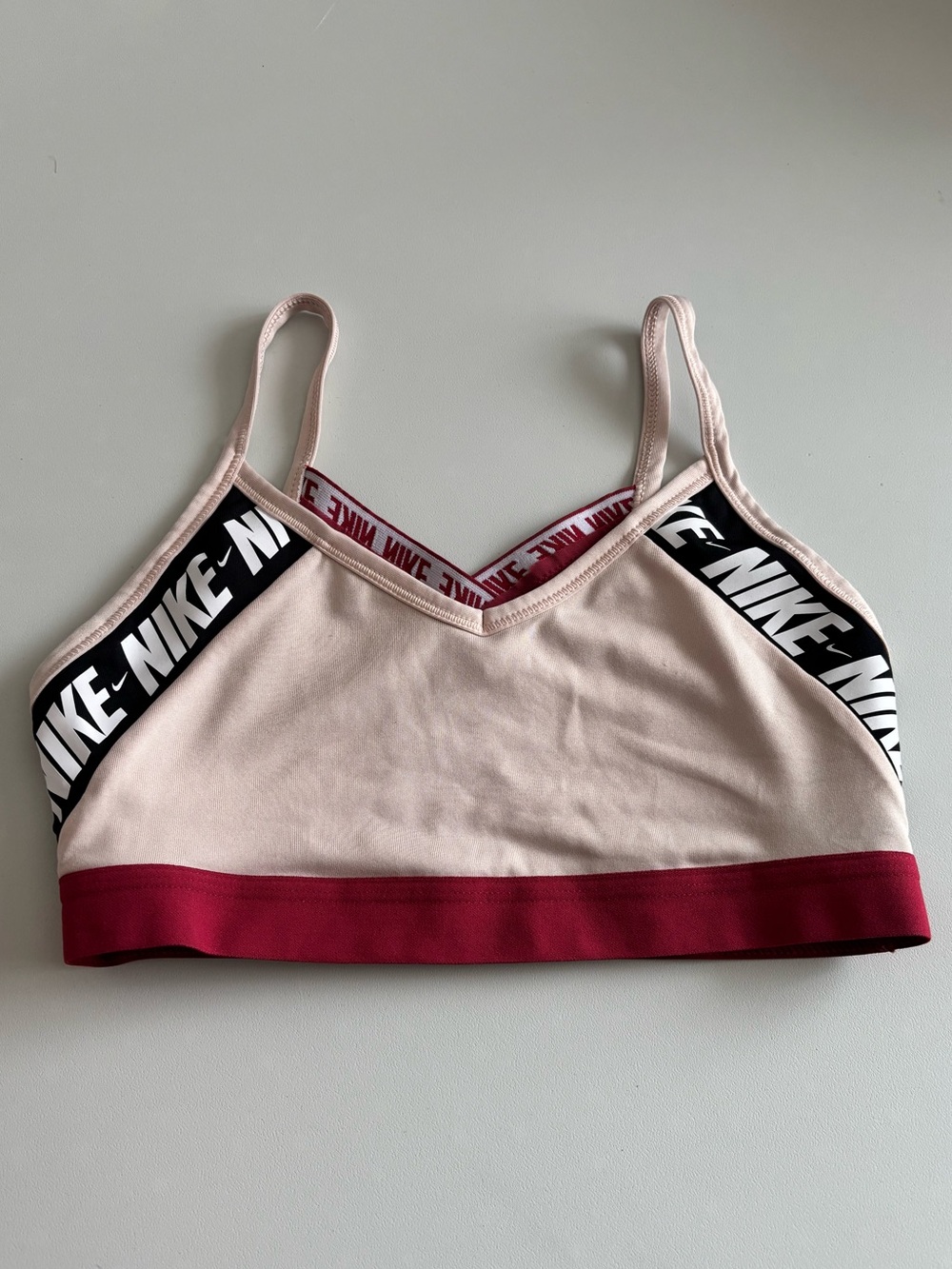 Big Girls Nike Pink Sports Bra with Maroon Band and Black Logo Trim